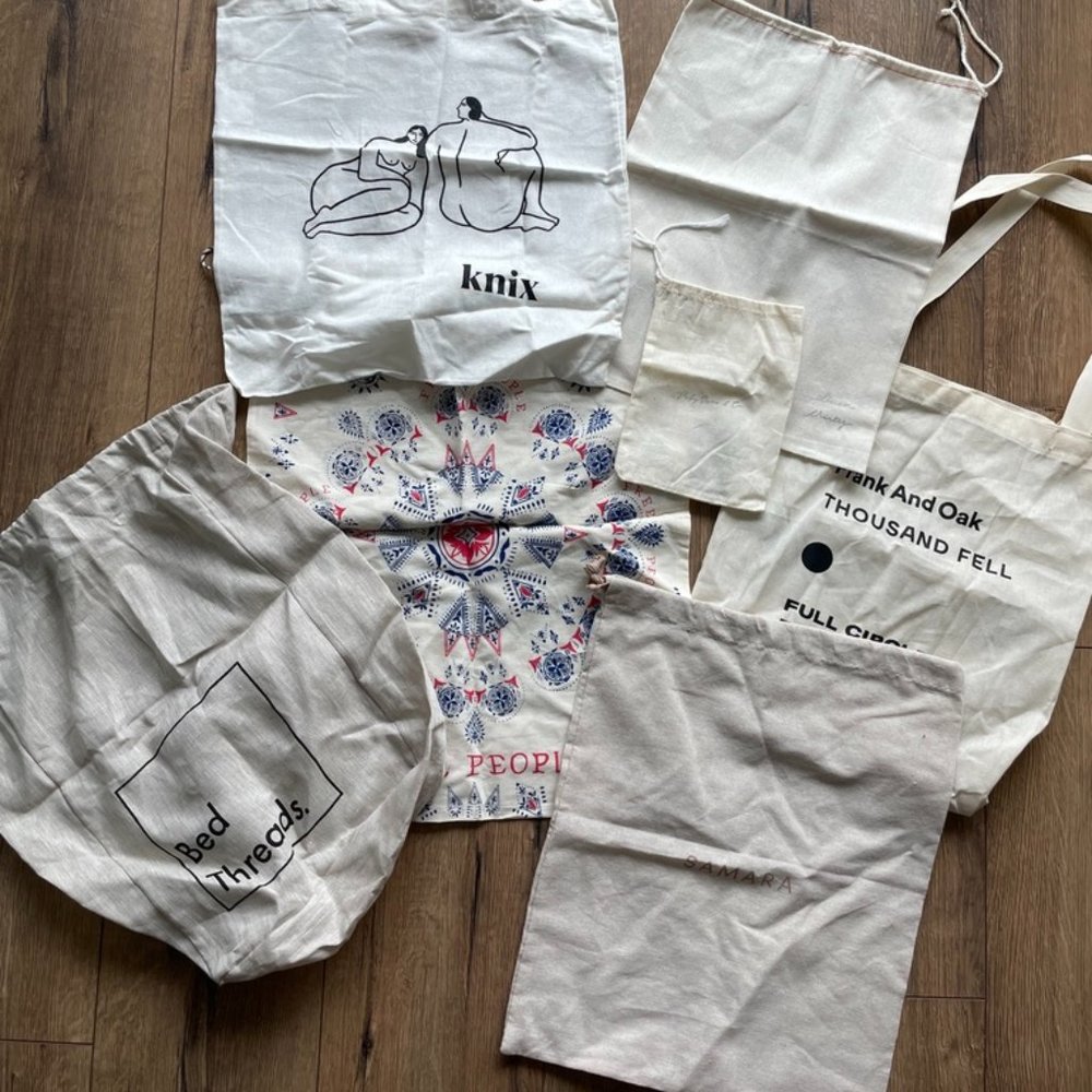 Assorted Reusable book bags, totes & dust covers